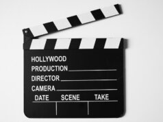 a black and white movie clapper on a white background