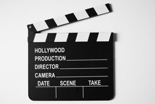 a black and white movie clapper on a white background