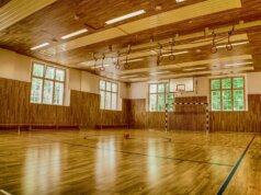 brown wooden parquet floor with white wall