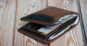 a wallet is open on a wooden table