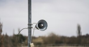 a black and white camera on a pole