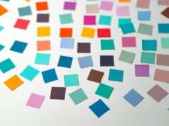 a white table topped with lots of different colored squares