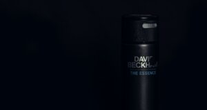a bottle of deodorant on a black background