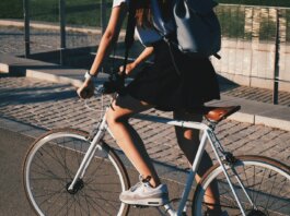 woman riding white rigid bike